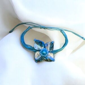 Dyed aqua flower shell multi cord adjustable bracelet